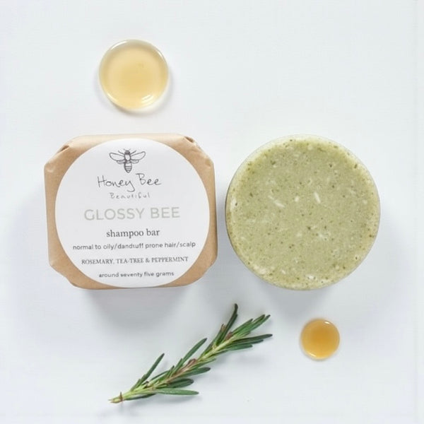 Eco-friendly Glossy Bee shampoo bar with raw honey and natural oils - pH-balanced and gentle, designed for normal to oily or dandruff-prone hair, clarifies scalp, leaving hair soft, light, bouncy, shiny, and healthy without residue.