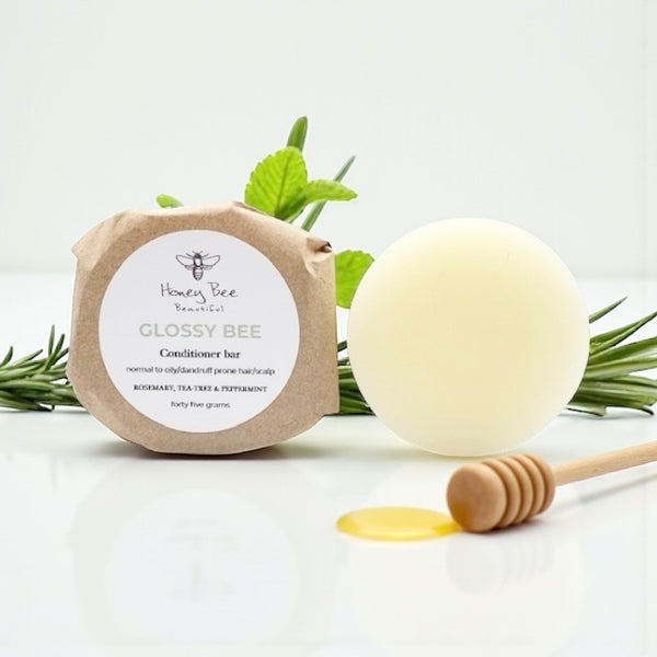 Solid Glossy Bee conditioner bar enriched with raw honey and natural oils nourishes, softens, and strengthens normal, oily, or dandruff-prone hair, leaving strands smooth, shiny, silky, and protected.
