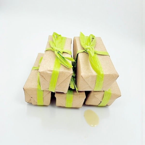 Stack of mini natural honey soap with lemongrass, patchouli, beeswax and plant oils,  refreshing, gentle formula for dry or sensitive skin, perfect for peri- or menopausal skin.
