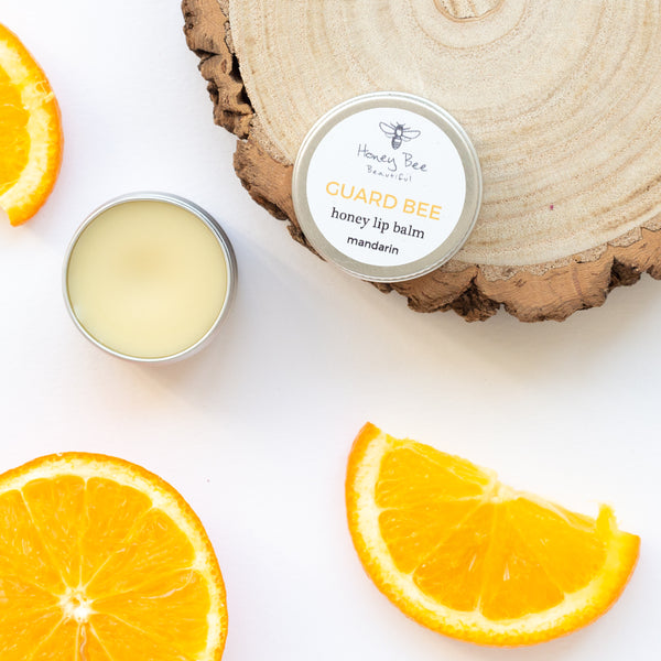 Nourishing mandarin lip balm with raw Welsh honey and beeswax, perfect for dry and sensitive lips.