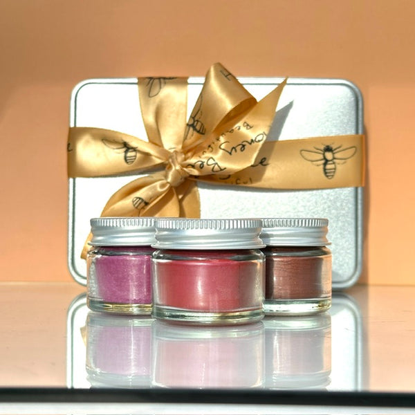 Elegant gift set with rose-infused raw honey skincare products presented in a box designed for dry or menopausal skin that needs calming nourishment and a spa-like ritual.
