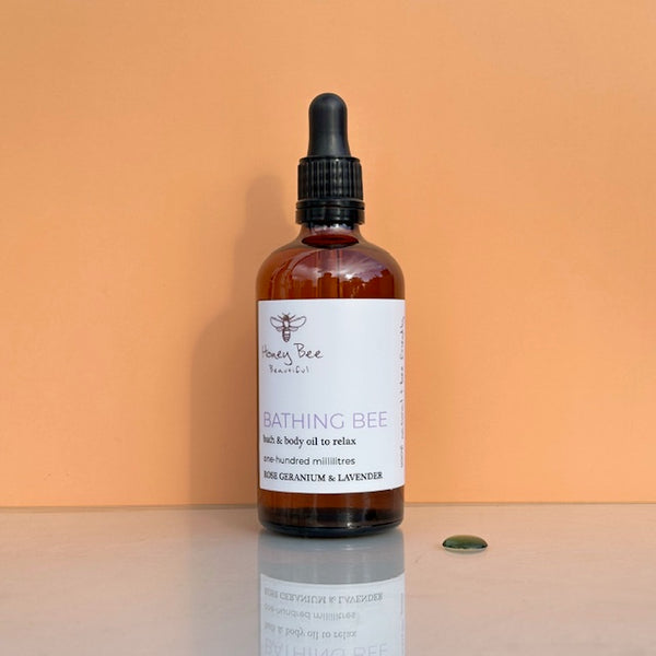 Honey and botanical natural bath and body oil for dry skin.