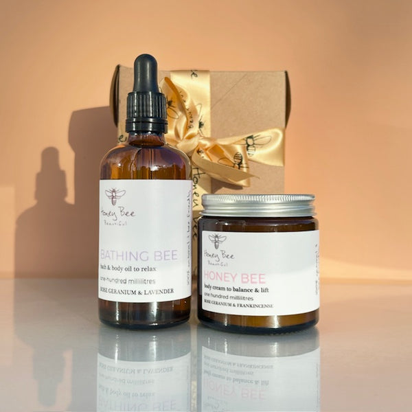 Honey & botanical bath and body set containing a honey bath & body oil and a luxurious rose and frankincnse body cream.  Layer for decadant results!