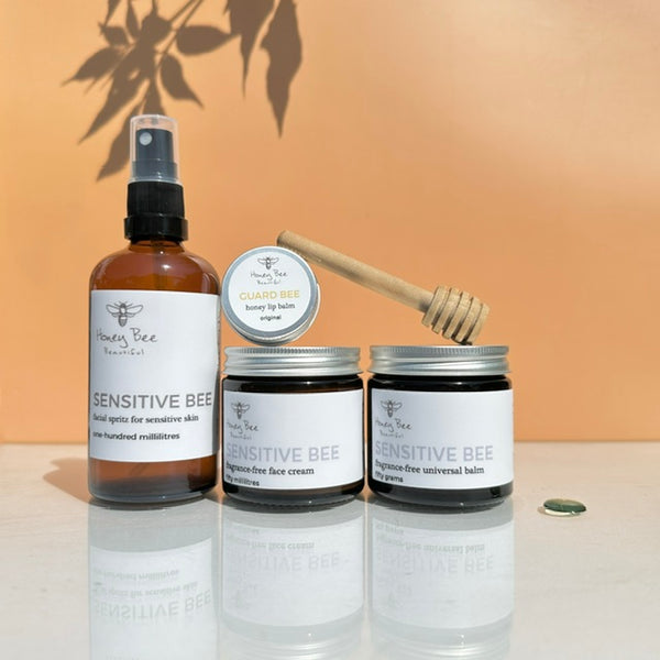 Bundle of rfragrance free raw honey skincare products including moisturising face cream, beeswax balm, hydrating face spritz and honey lip balm - especially formulated to nourish, protect, and soothe dry, sensitive menopausal skin, restoring moisture and comfort.