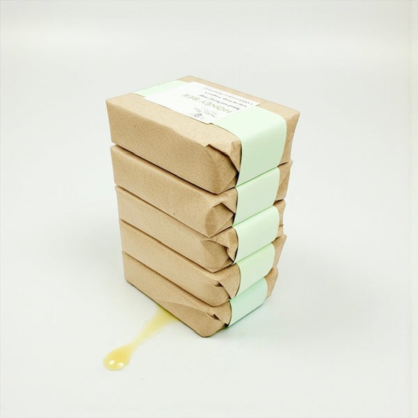 Stack of natural honey soap with lemongrass, patchouli, beeswax and plant oils,  refreshing, gentle formula for dry or sensitive skin, perfect for peri- or menopausal skin.