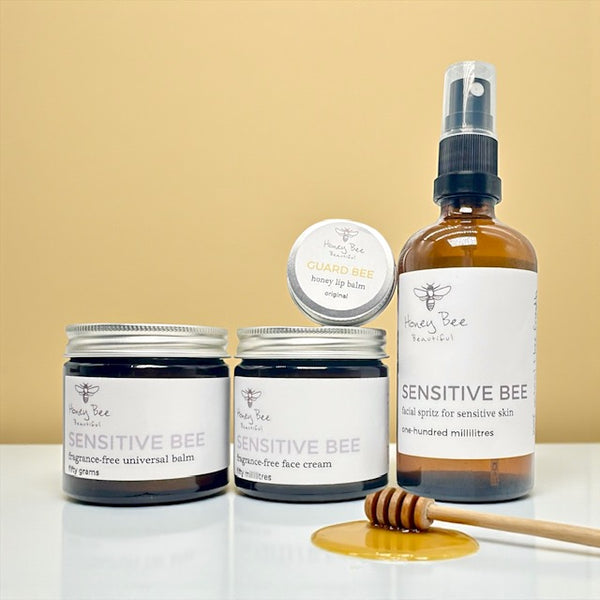Mini gift set of fragrance free raw honey skincare products including face cream, hand cream, and lip balm - especially formulated to nourish, protect, and soothe dry, sensitive menopausal skin, restoring moisture and comfort.