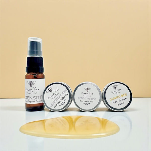 Mini gift set of fragrance free raw honey skincare products including face cream, hand cream, and lip balm - especially formulated to nourish, protect, and soothe dry, sensitive menopausal skin, restoring moisture and comfort.