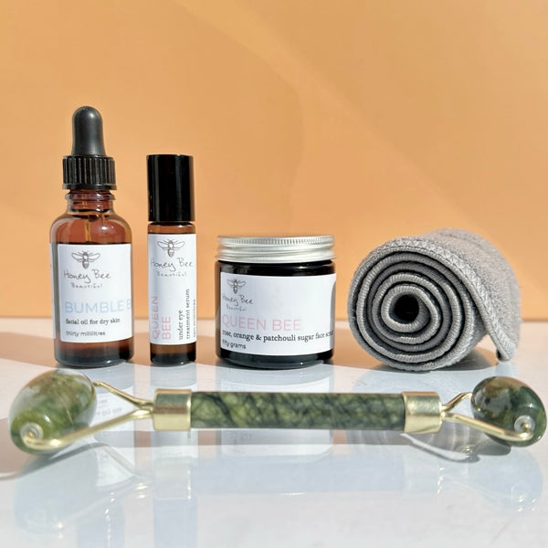 Raw honey face care set to plump and glow skin with oil, exfoliator and jade roller